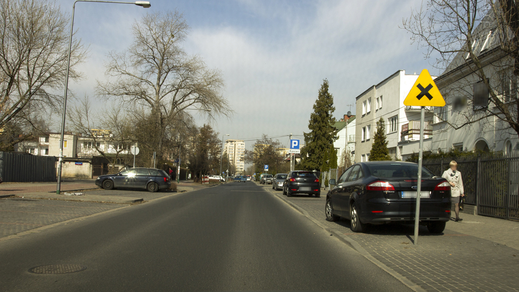 When driving at the speed of 50 km/h should you slow down while approaching the closest junction when the situation on the right hand side of the road is not adequately visible?
